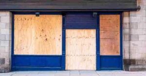 Boarding Up a Shop in Bidston